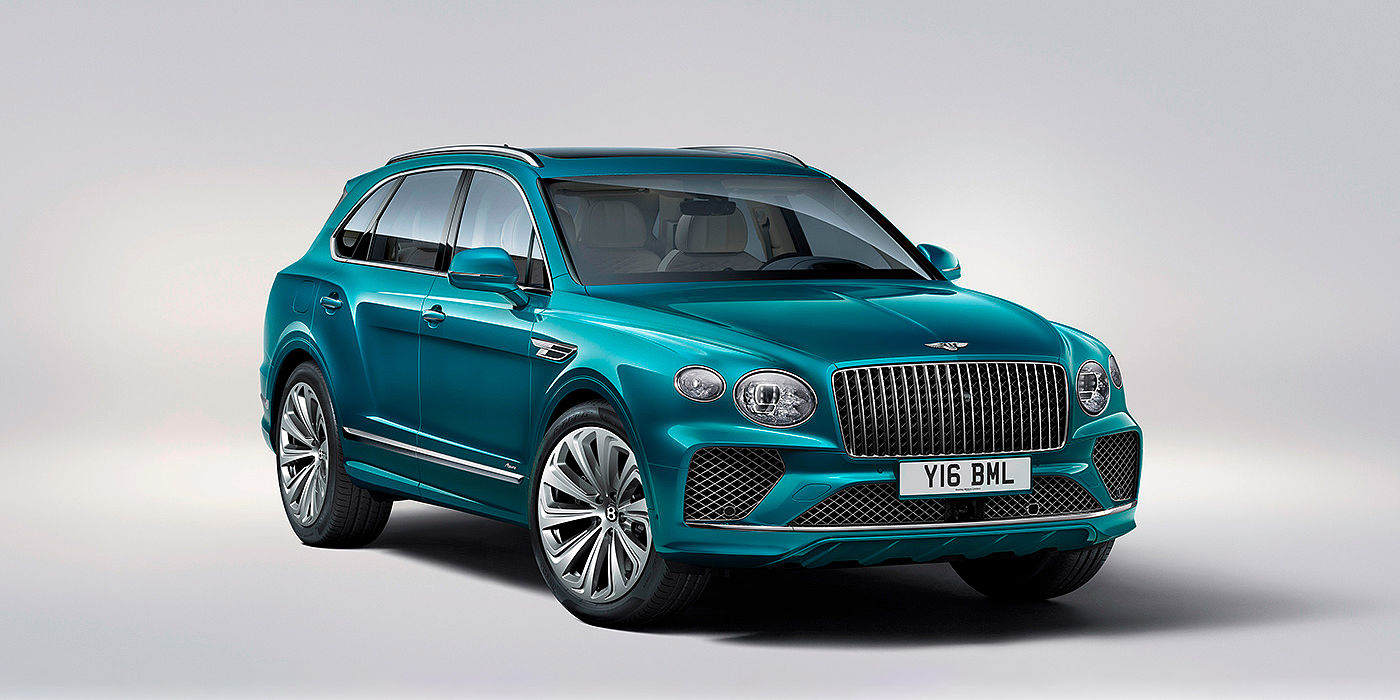 Bentley Brussels Bentley Bentayga Azure front three-quarter view, featuring a fluted chrome grille with a matrix lower grille and chrome accents in Topaz blue paint.