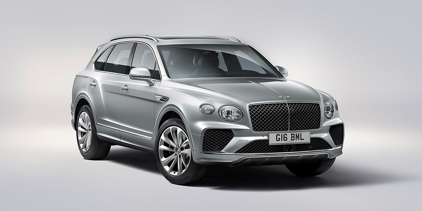Bentley Brussels Bentley Bentayga in Moonbeam paint, front three-quarter view, featuring a matrix grille and elliptical LED headlights.