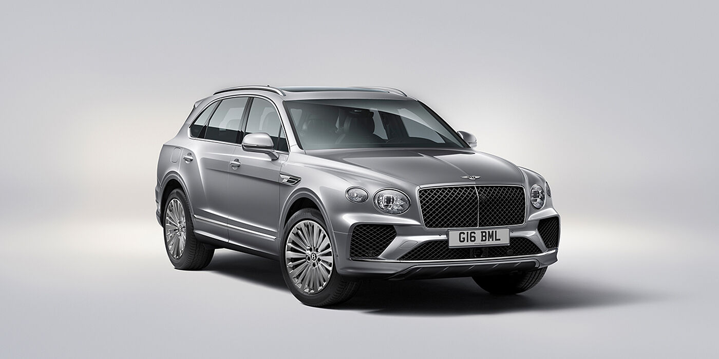 Bentley Brussels Bentley Bentayga luxury SUV front three quarter view in Moonbeam paint with matrix grille and 21″ 5 spoke painted wheels