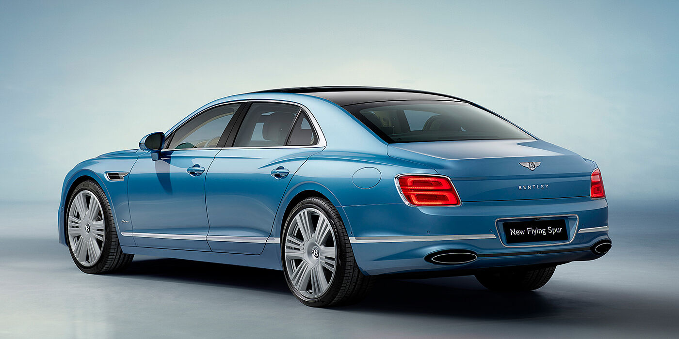 Bentley Brussels New Bentley Flying Spur Azure sedan rear view in Light windsor blue by Mulliner paint with 22 inch Azure wheels and chrome exterior details