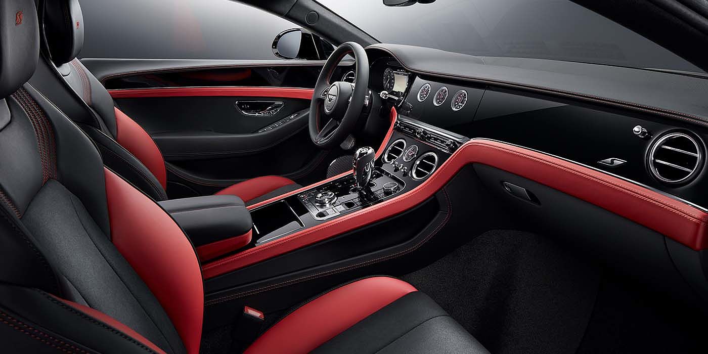 Bentley Brussels Bentley Continental GT S coupe front interior in Beluga black and Hotspur red hide with high gloss Carbon Fibre veneer