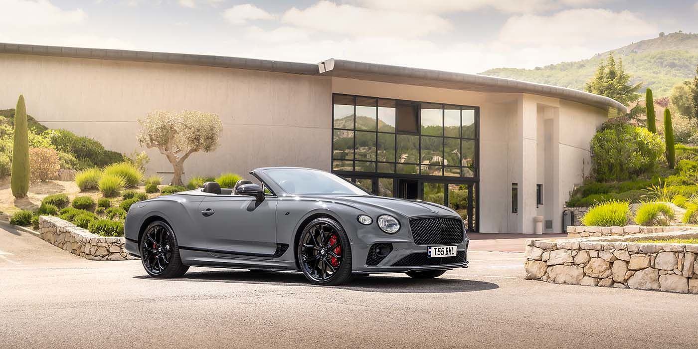 Bentley Brussels Bentley Continental GTC S convertible in Cambrian Grey paint front 34 static near house