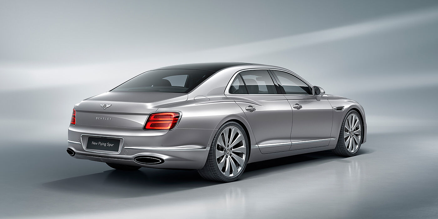 Bentley Brussels New Bentley Flying Spur sedan rear view in Silverlake paint with ten spoke wheels and chrome matrix grille