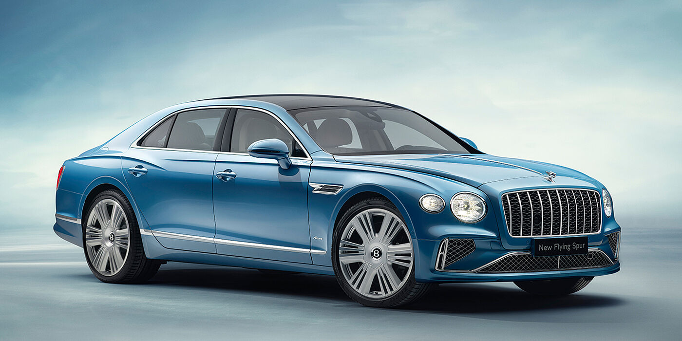 Bentley Brussels New Bentley Flying Spur Azure sedan front view in Light windsor blue by Mulliner paint with 22 inch Azure wheels and chrome exterior details