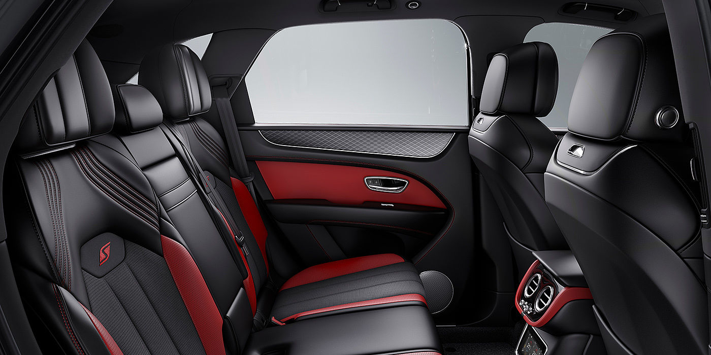 Bentley Brussels Bentey Bentayga S interior view for rear passengers with Beluga black and Hotspur red coloured hide.