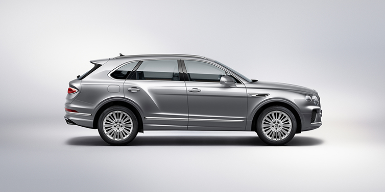 Bentley Brussels Bentley Bentayga SUV side profile in Moonbeam silver paint against white background featuring 21 inch 5 spoke wheels