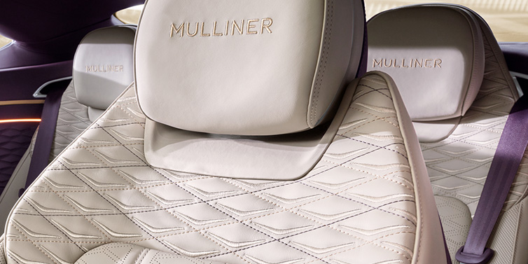 Bentley Brussels Bentley Continental GT Mulliner coupe seat detail in Linen leather with Mulliner Diamond in Diamond quilting and Mulliner embroidered seat emblem